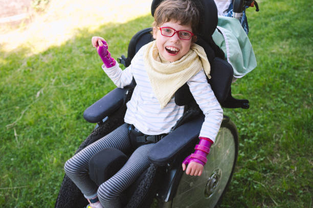 image of student with disabilities in wheelchair on the lawn
